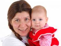 bigstockphoto_Woman_With_A_Little_Baby_2544309
