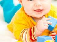 bigstockphoto_Happy_Baby_Girl_Playing_With_M_7239659