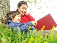 bigstock_Happy_children_reading_the_boo_15439361