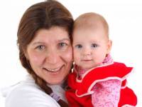 bigstockphoto_Woman_With_A_Little_Baby_2544309
